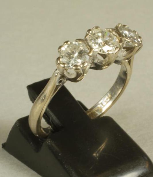 A THREE STONE DIAMOND RING Image