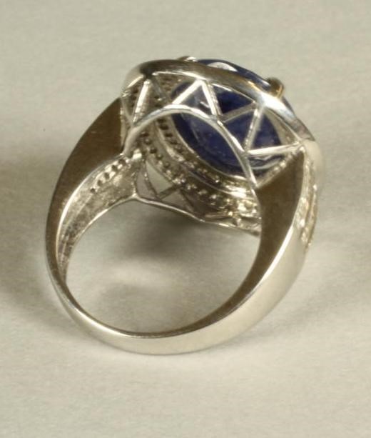 A SAPPHIRE AND DIAMOND CLUSTER RING Image