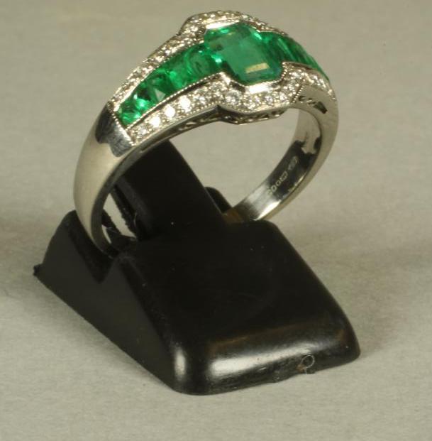 AN EMERALD AND DIAMOND DRESS RING Image