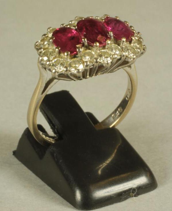 A RUBY AND DIAMOND TRIPLE CLUSTER RING Image