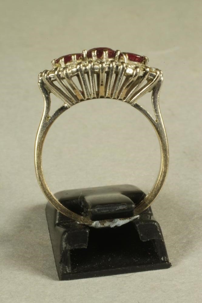 A RUBY AND DIAMOND TRIPLE CLUSTER RING Image