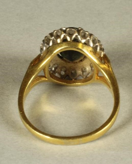 A SAPPHIRE AND DIAMOND CLUSTER RING Image