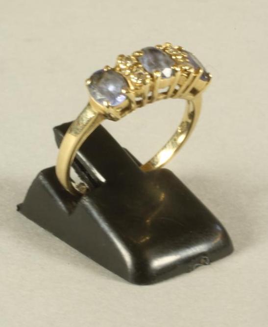 A THREE STONE TANZANITE RING Image