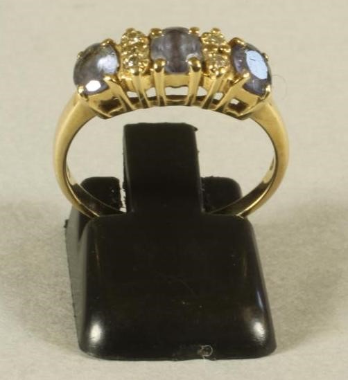 A THREE STONE TANZANITE RING Image