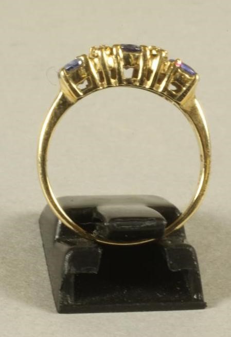 A THREE STONE TANZANITE RING Image