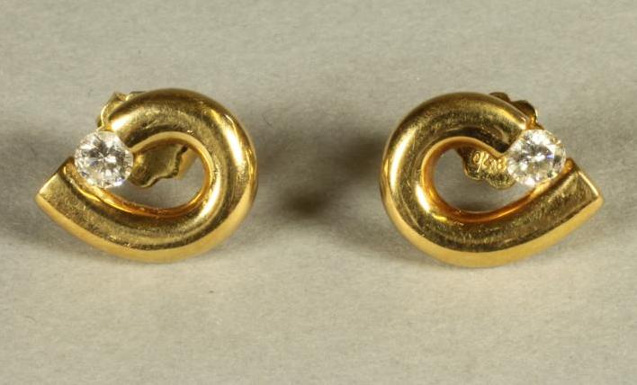 A PAIR OF DIAMOND SET EAR STUDS Image