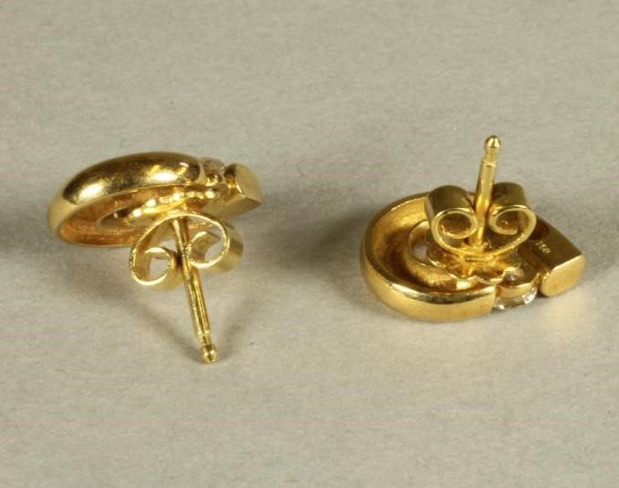 A PAIR OF DIAMOND SET EAR STUDS Image