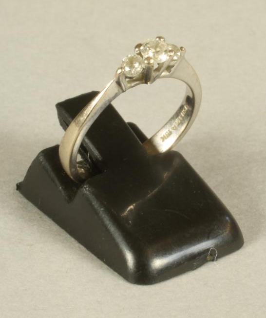 A THREE STONE DIAMOND RING Image