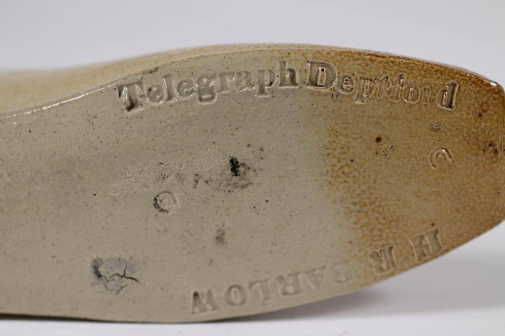 A SALTGLAZE STONEWARE SHOE WARMER Image