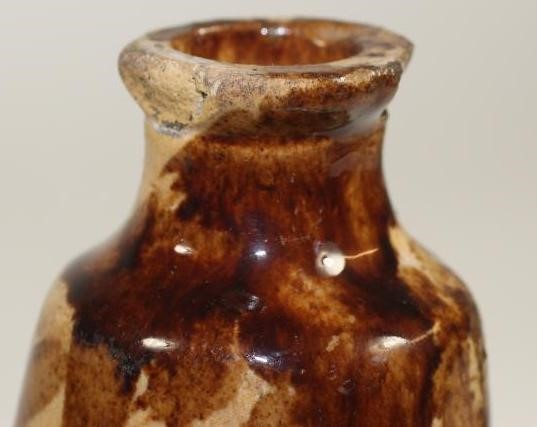 A SALTGLAZE STONEWARE SHOE WARMER Image