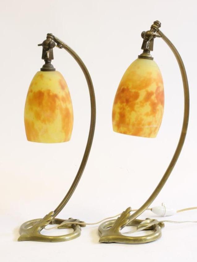 A COMPOSITE PAIR OF ART NOUVEAU MARJORELLE STYLE BRASS LAMPS Image