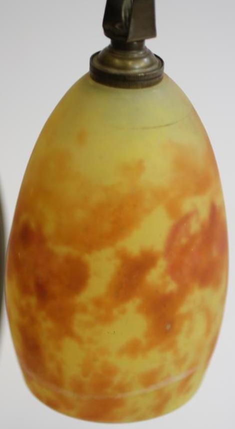 A COMPOSITE PAIR OF ART NOUVEAU MARJORELLE STYLE BRASS LAMPS Image