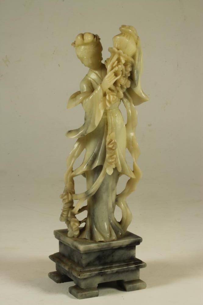 A CHINESE SOAPSTONE FIGURE Image