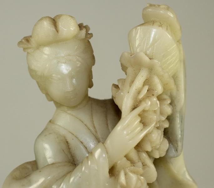 A CHINESE SOAPSTONE FIGURE Image