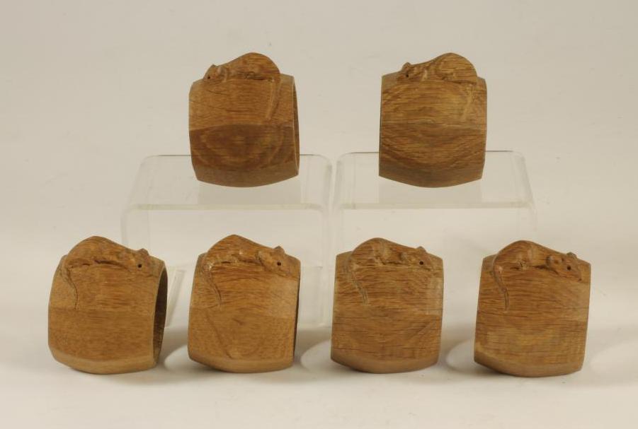 A SET OF SIX ROBERT THOMPSON OAK NAPKIN RINGS of octagonal form Image