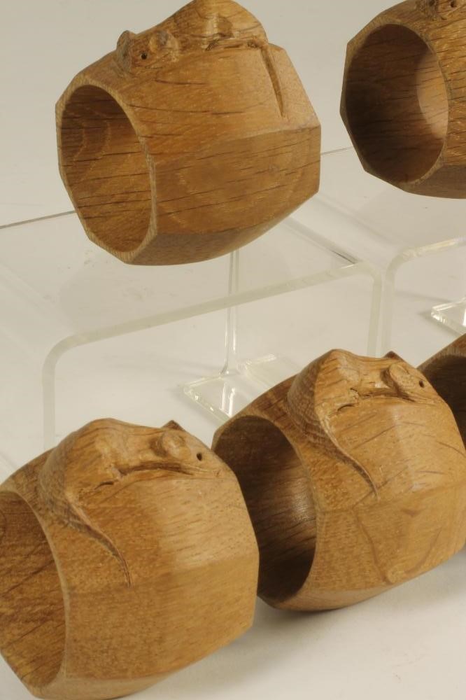 A SET OF SIX ROBERT THOMPSON OAK NAPKIN RINGS of octagonal form Image