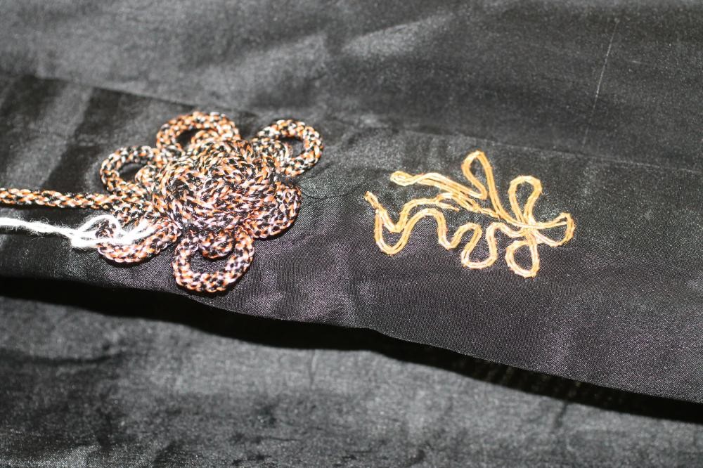 A JAPANESE BLACK SILK KIMONO Image