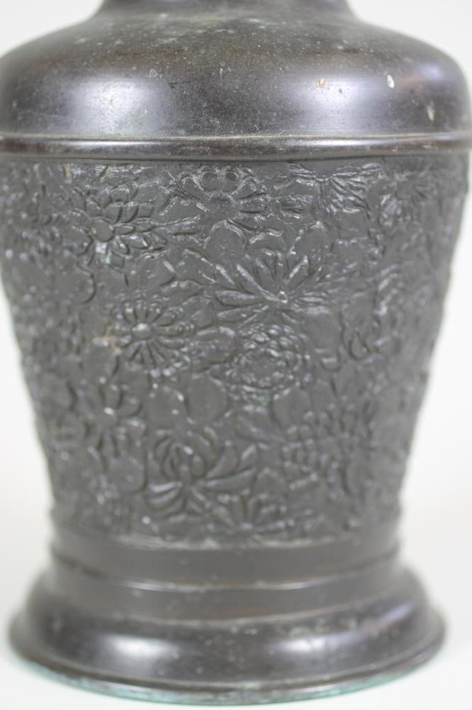 A CHINESE BRONZE VASE of flared cylindrical form with sloping shoulders and tall neck case in low Image