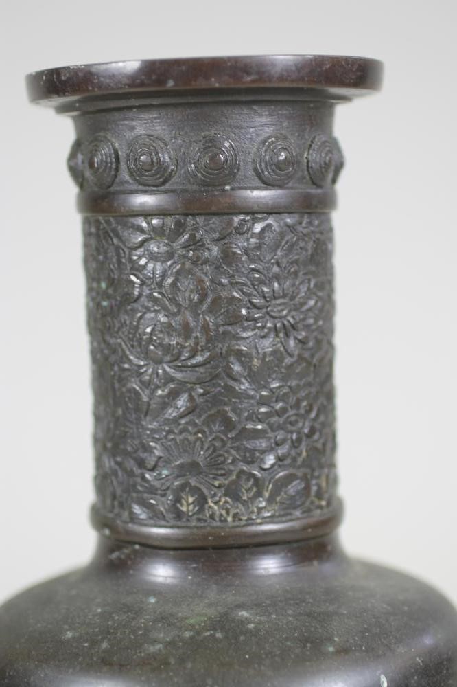 A CHINESE BRONZE VASE of flared cylindrical form with sloping shoulders and tall neck case in low Image