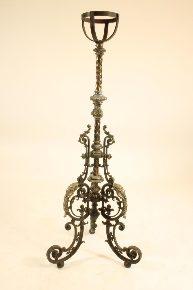 A VICTORIAN CAST IRON AND BRASS TORCHERE Image