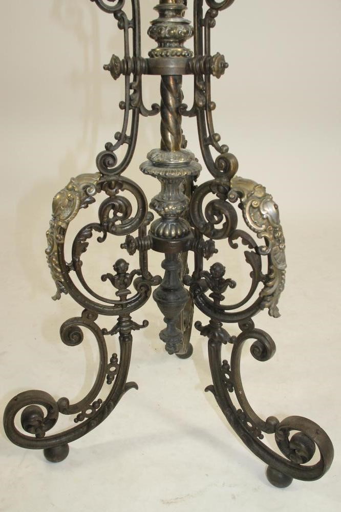 A VICTORIAN CAST IRON AND BRASS TORCHERE Image
