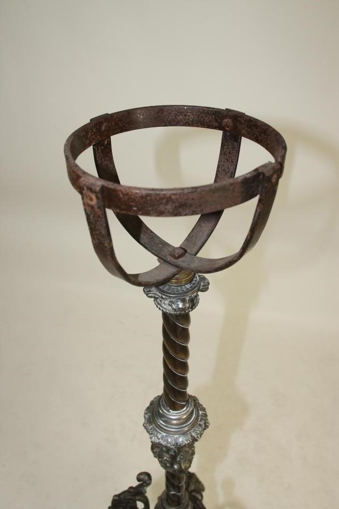 A VICTORIAN CAST IRON AND BRASS TORCHERE Image