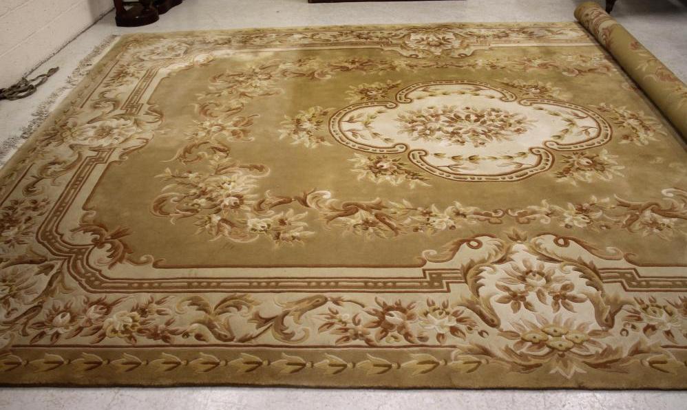 A CHINESE WASHED AND FRINGED CARPET Image