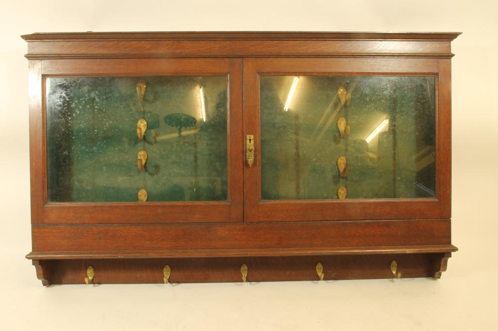 AN ARMY & NAVY OAK BRACKET GUN CABINET Image