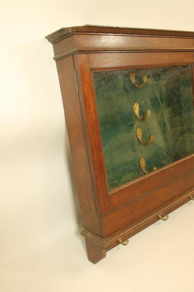 AN ARMY & NAVY OAK BRACKET GUN CABINET Image