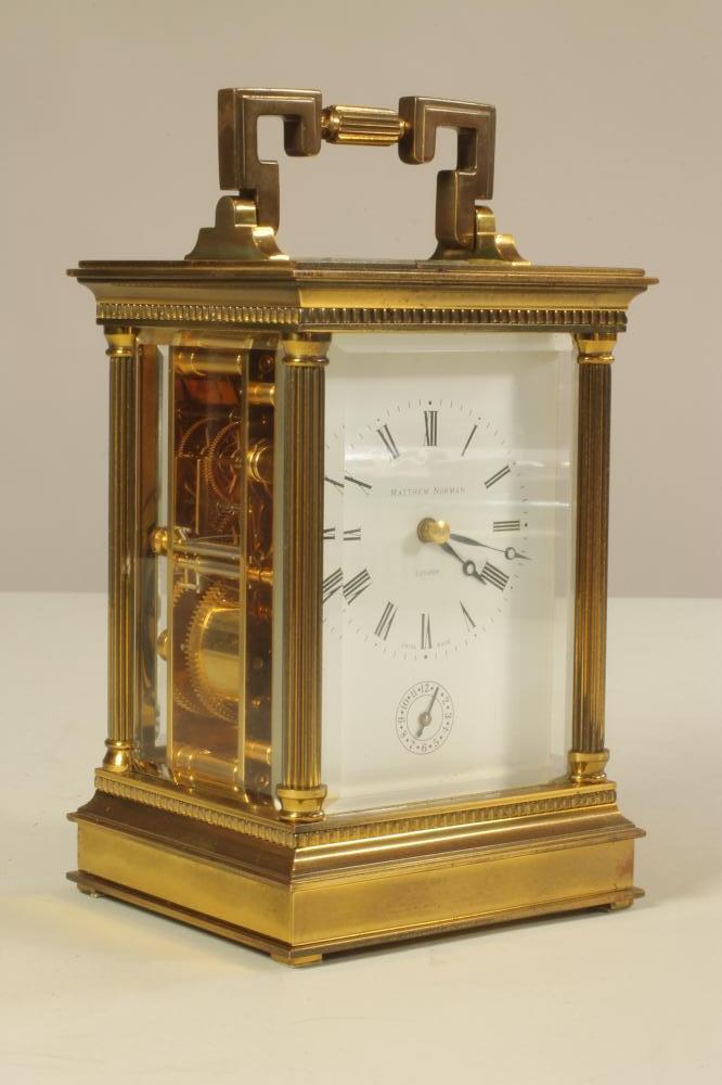 A MATTHEW NORMAN BRASS CASED CARRIAGE CLOCK Image