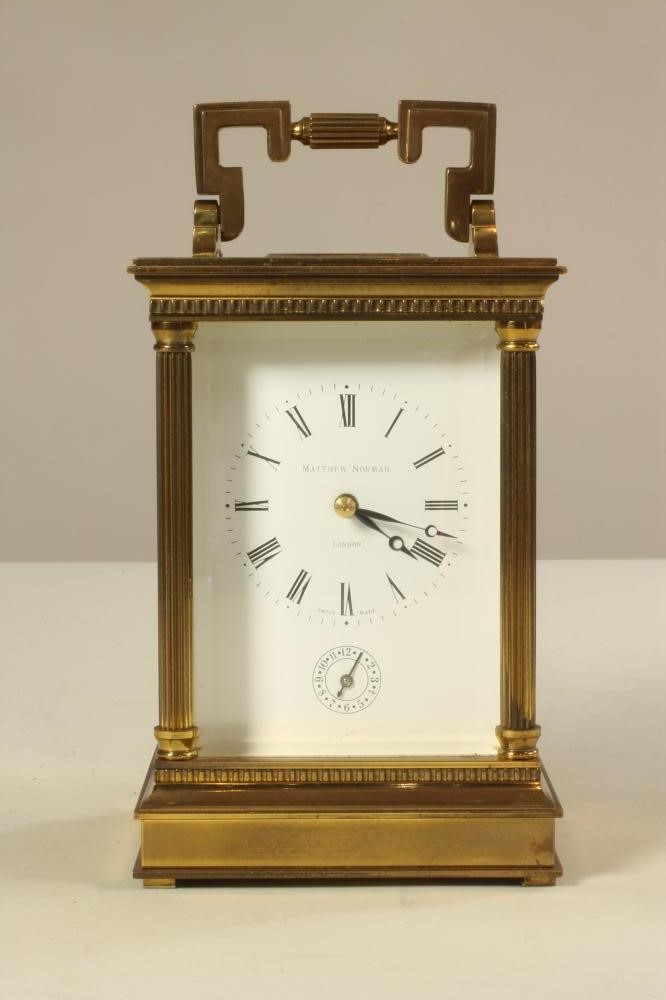 A MATTHEW NORMAN BRASS CASED CARRIAGE CLOCK Image