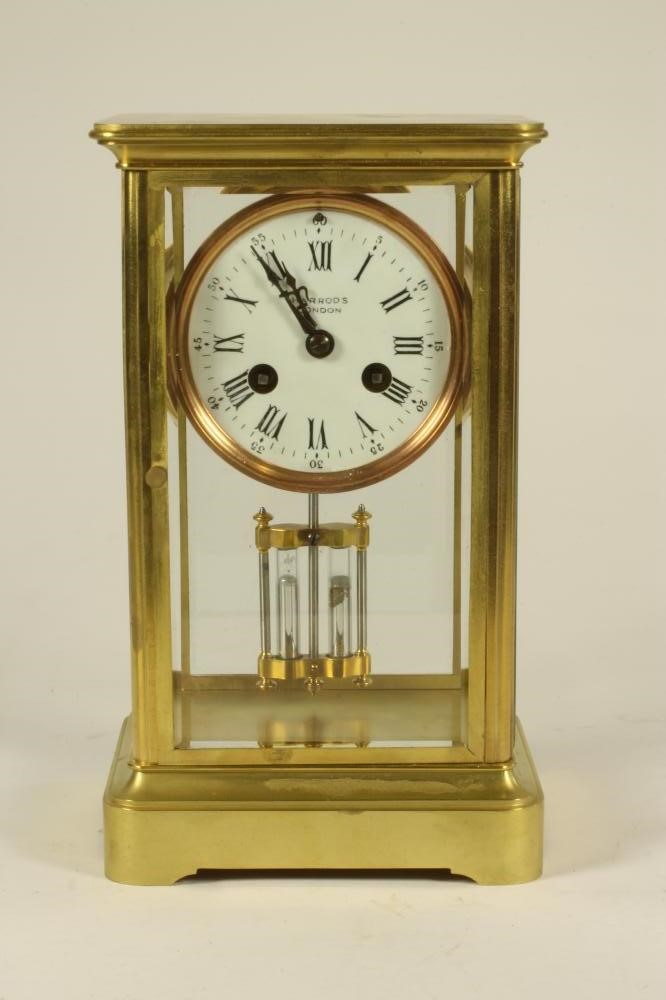 A BRASS CASED FOUR GLASS MANTEL CLOCK Image