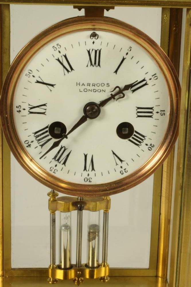 A BRASS CASED FOUR GLASS MANTEL CLOCK Image