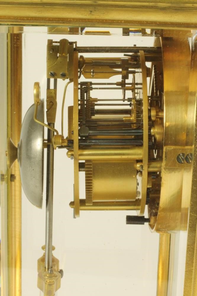 A BRASS CASED FOUR GLASS MANTEL CLOCK Image