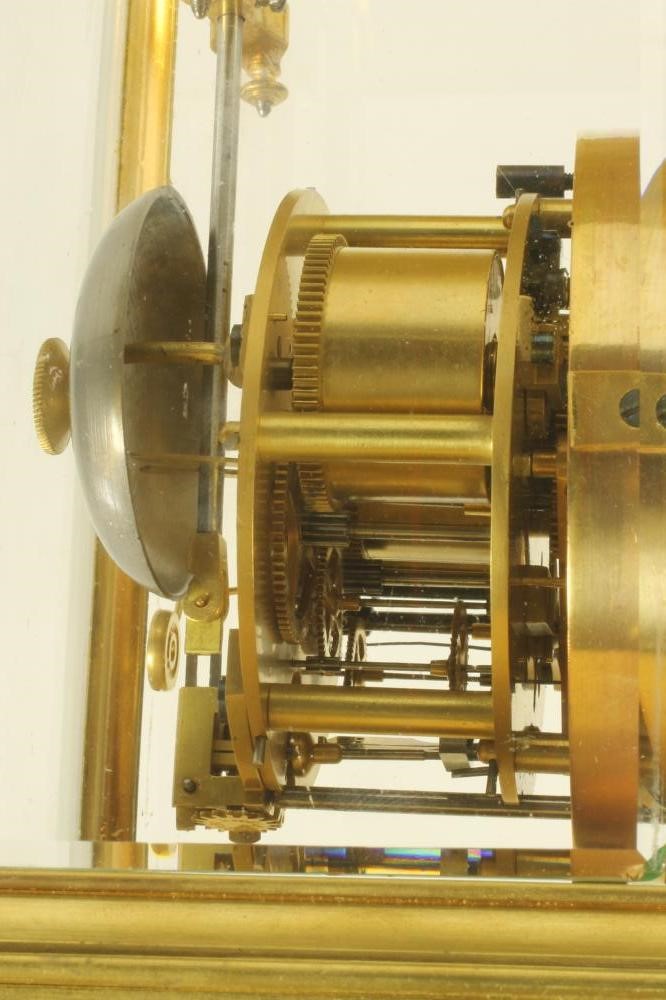 A BRASS CASED FOUR GLASS MANTEL CLOCK Image