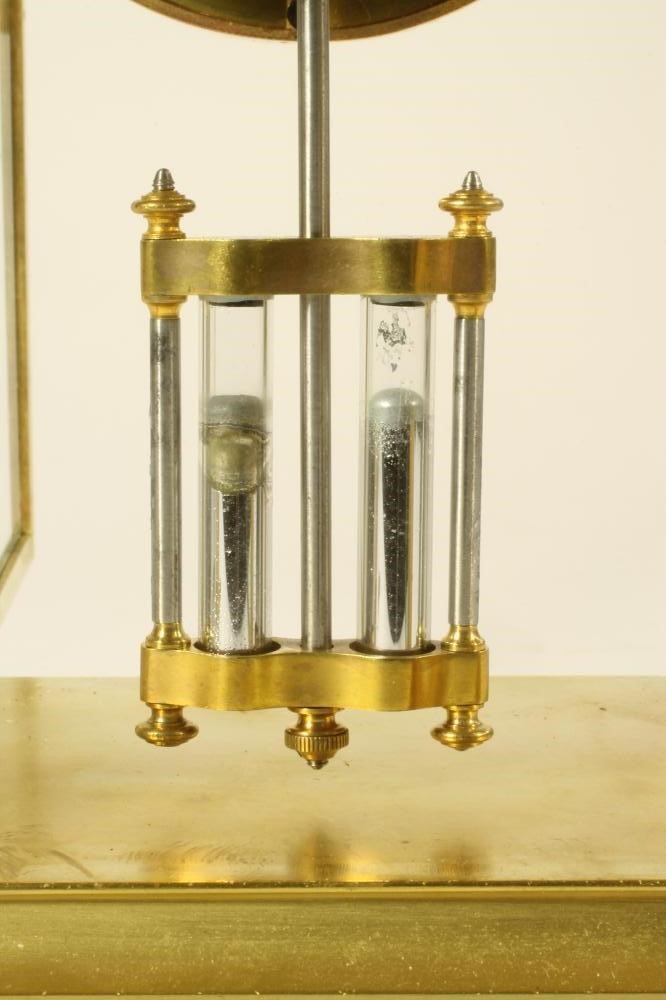 A BRASS CASED FOUR GLASS MANTEL CLOCK Image