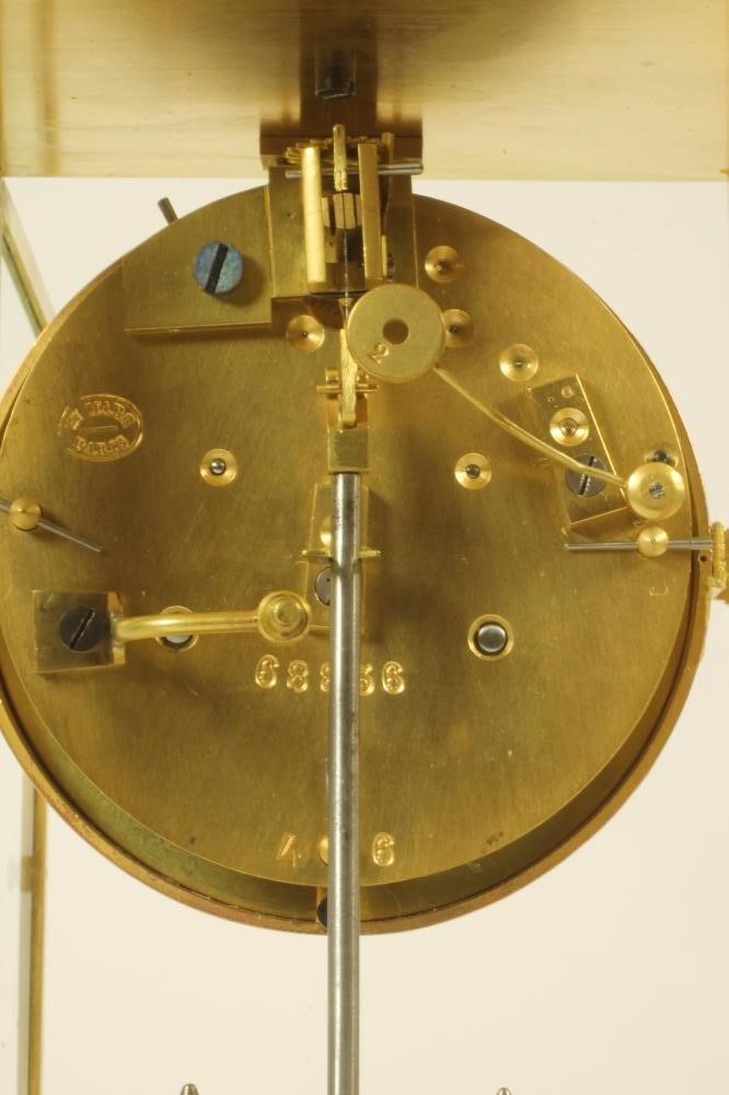 A BRASS CASED FOUR GLASS MANTEL CLOCK Image