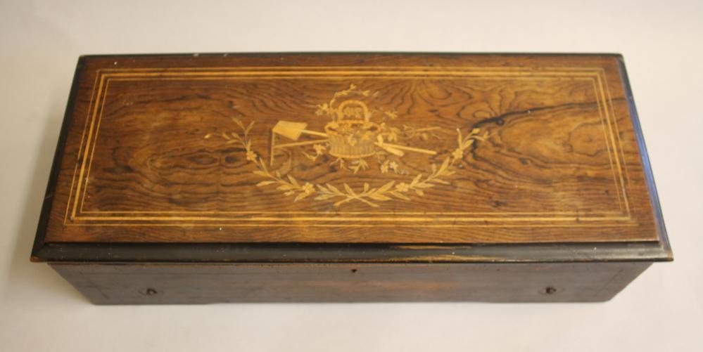 A VICTORIAN WALNUT CASED MUSICAL BOX with 10 1/2" comb and drum movement Image