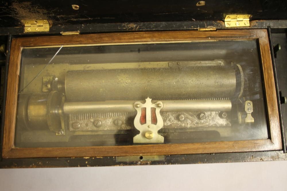 A VICTORIAN WALNUT CASED MUSICAL BOX with 10 1/2" comb and drum movement Image