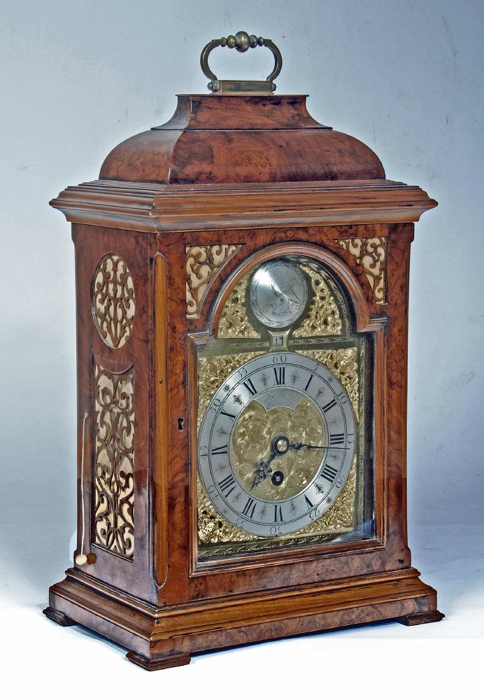 A GEORGIAN WALNUT CASED TABLE CLOCK Image