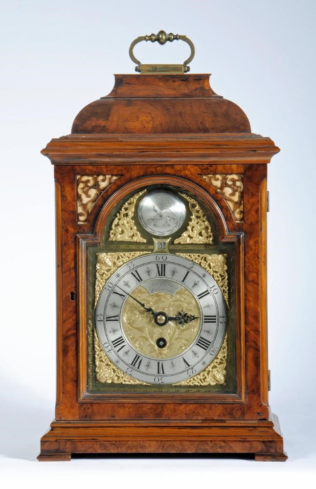 A GEORGIAN WALNUT CASED TABLE CLOCK Image