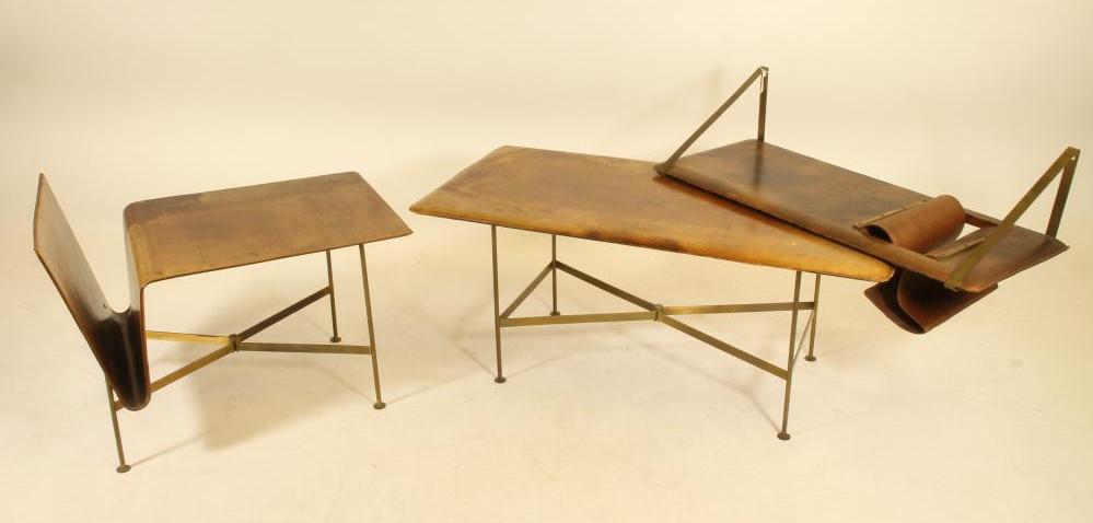 A LEATHER BOUND AND BRASS COFFEE TABLE in the manner of Jacques Adnet Image
