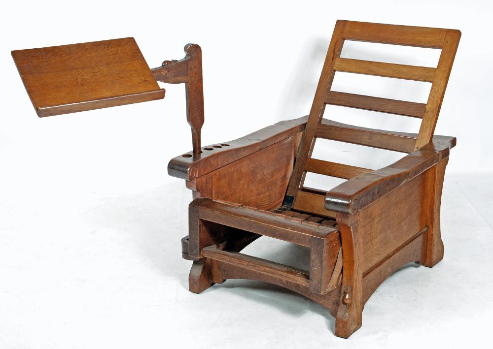 AN ADZED OAK RECLINING READING CHAIR BY ROBERT THOMPSON Image