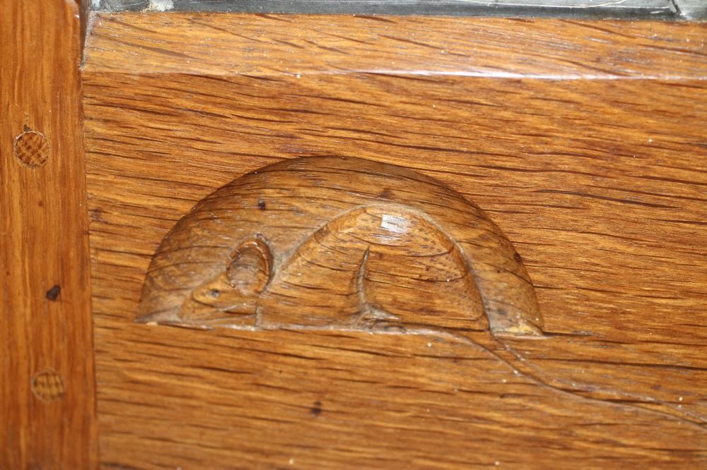 AN OAK AND LEAD GLAZED CORNER CUPBOARD BY ROBERT THOMPSON Image