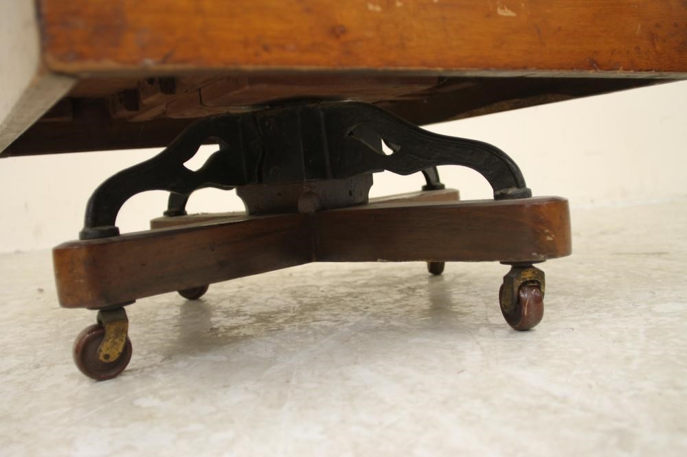 A LATE VICTORIAN MAHOGANY REVOLVING BOOKCASE of three tier square form with part slatted sides Image