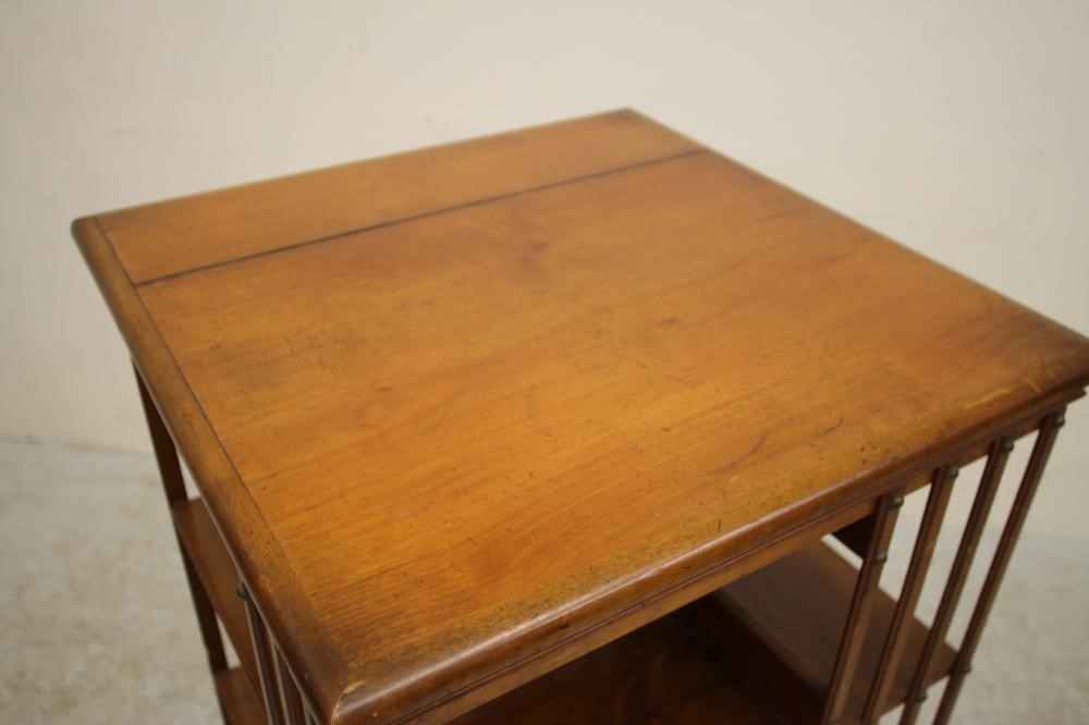 A LATE VICTORIAN MAHOGANY REVOLVING BOOKCASE of three tier square form with part slatted sides Image