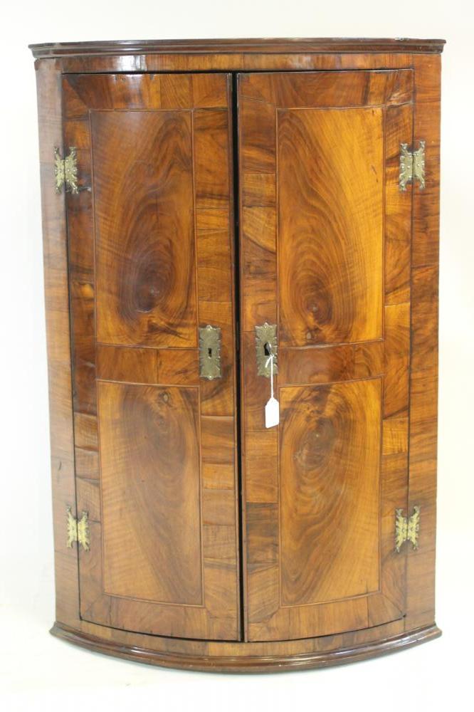 A GEORGIAN MAHOGANY AND ROSEWOOD BANDED CORNER CUPBOARD Image