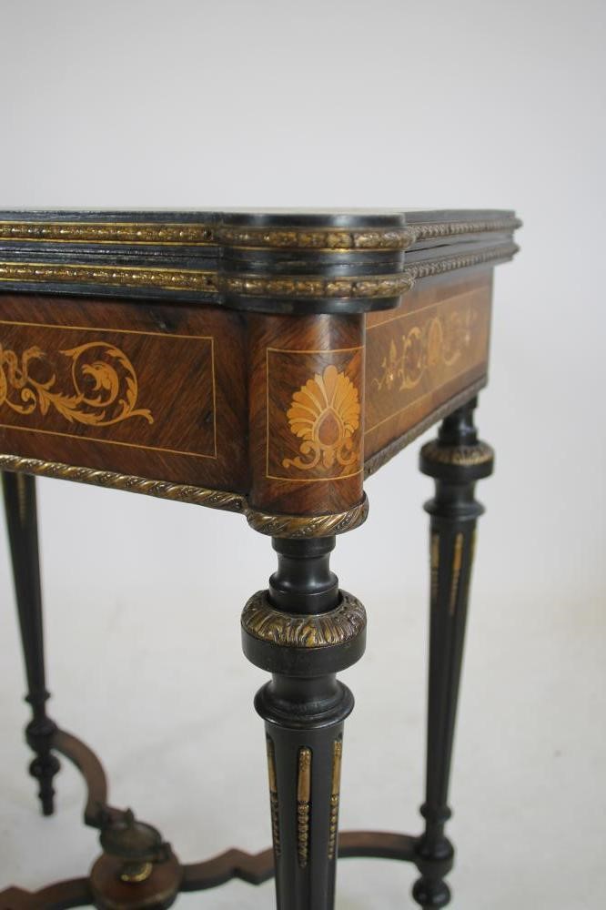 A VICTORIAN KINGWOOD AND MARQUETRY FOLDING CARD TABLE in the French revival style richly inlaid with Image