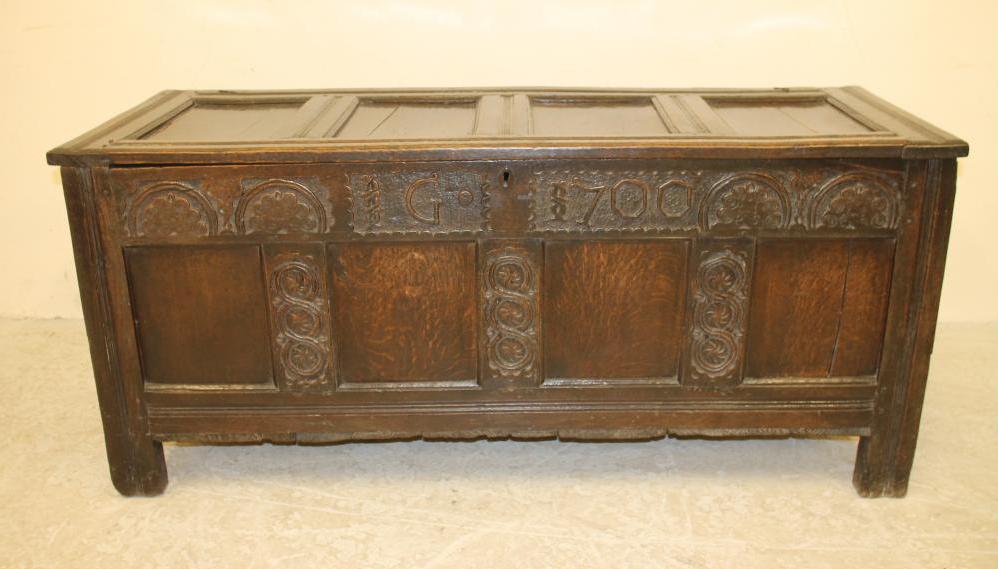 AN OAK PANELLED COFFER Image