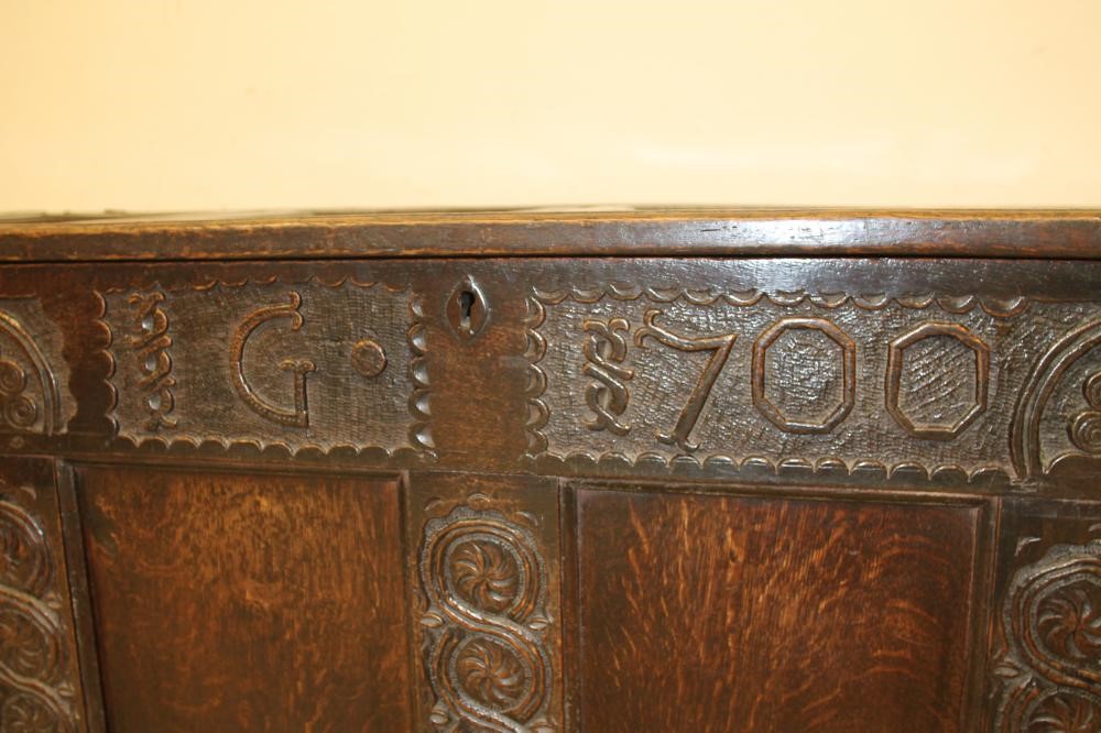 AN OAK PANELLED COFFER Image